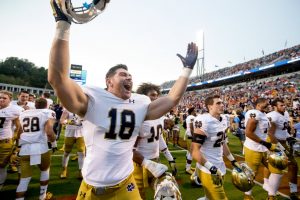 Notre Dame's Chase Hounshell (18) celebrates after the Fighting Irish's win over Virginia Saturday, September 12, 2015 in Charlottesville.