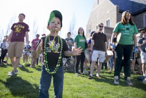 Noah Murawski, 2, uses his whistle while spending time with the Notre Dame Marching Band for the unveiling of this years design for The Shirt, Friday April 15, 2016 in South Bend. Murawski's family contacted the assistant band director to see if it was possible for the young music fan to visit during a practice. Instead, he was invited to Friday's event. The future band member was given his own whistle, taught to play instruments by band members and helped lead the victory march. Tribune photo/BECKY MALEWITZ