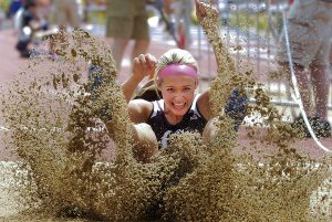 GCHS senior Taryn Tempel lands after one of her jumps in Friday's class 6A long jump competition during the state track meet at Wichita.